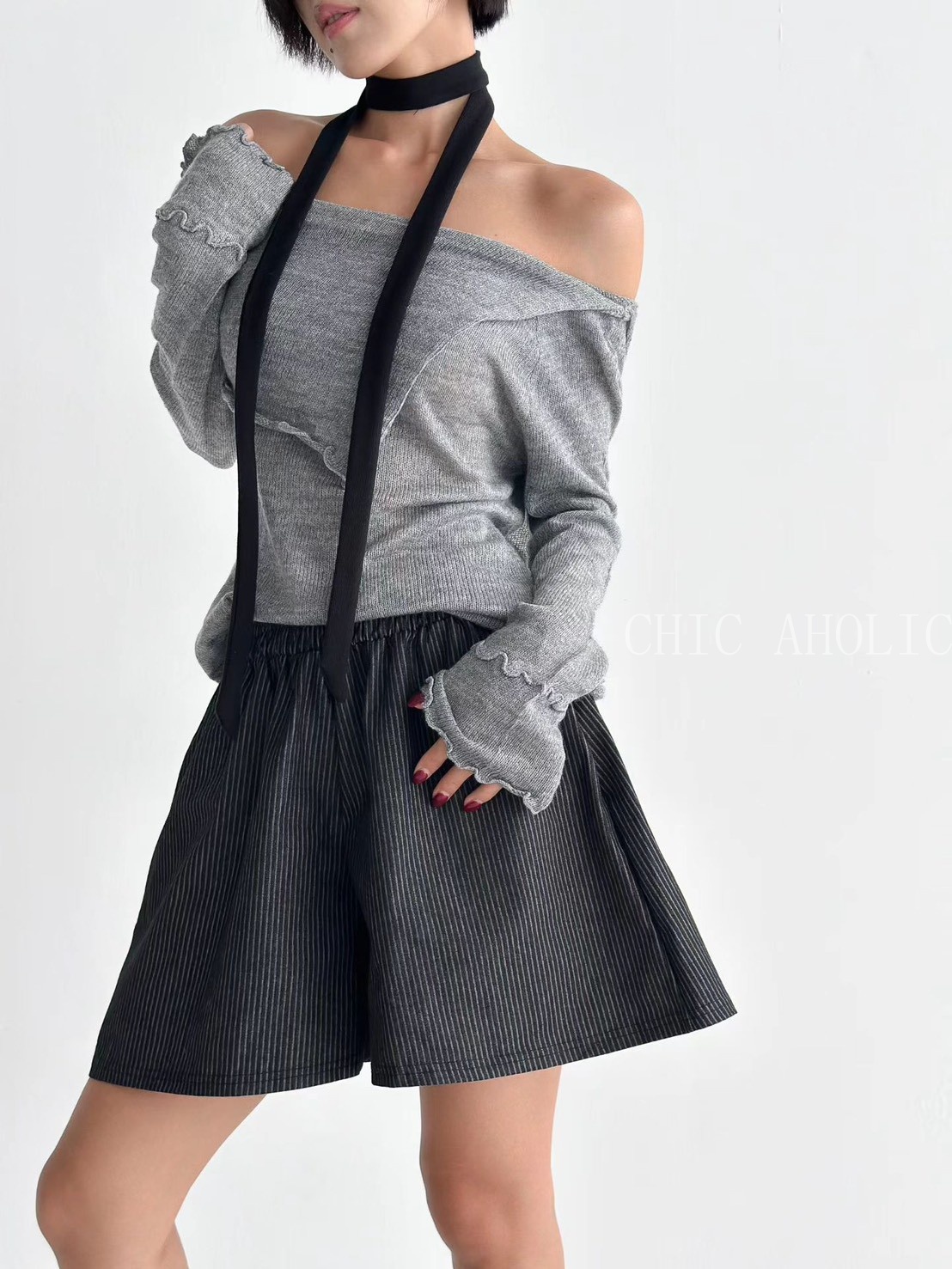 設計感斜擺捲邊針織衣